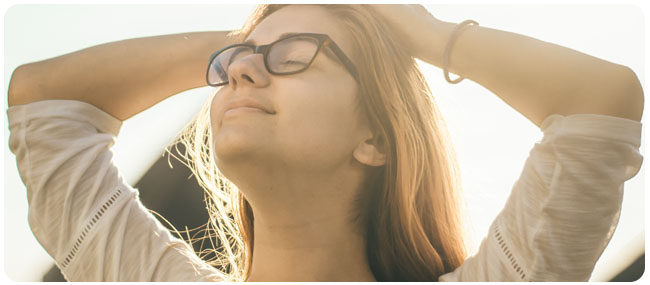 Woman smiling with eyes closed