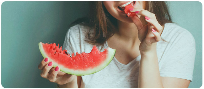 Woman eating a watermelon