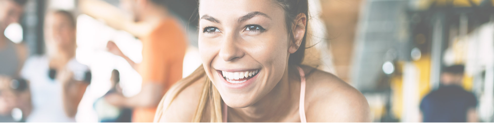 Woman with clear skin at the gym